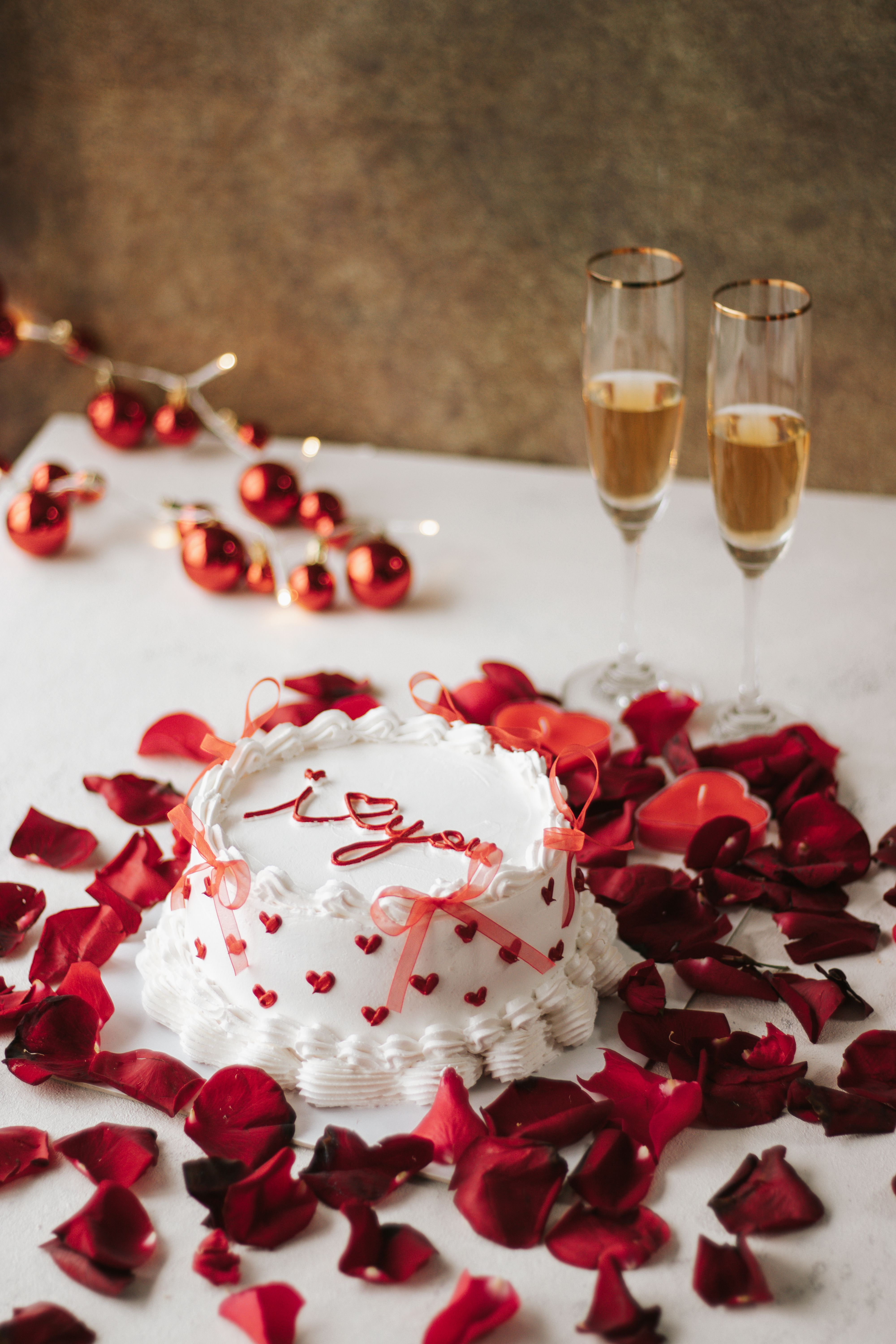 Romantic Cake with Rose Petals and Champagne · Free Stock Photo