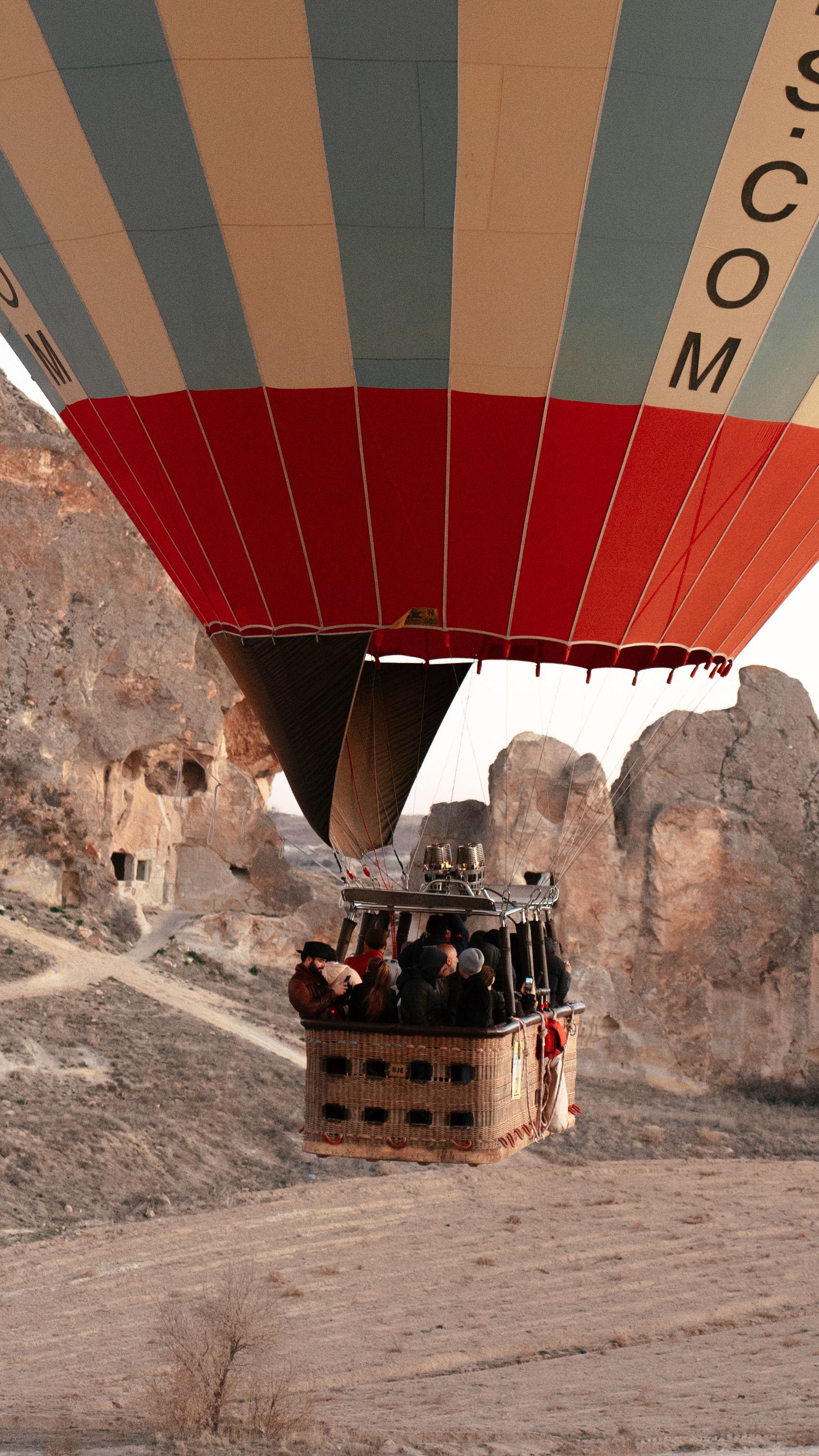 Scenic Hot Air Balloon Ride Over Rocky Terrain · Free Stock Photo