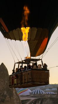 A captivating hot air balloon ride above Cappadocia's unique landscapes at sunrise.