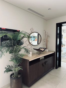 Stylish interior featuring modern decor, geometric sculptures, and lush plants.