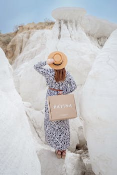 Woman in a stylish dress and hat at Calhan Paint Mines, Colorado.