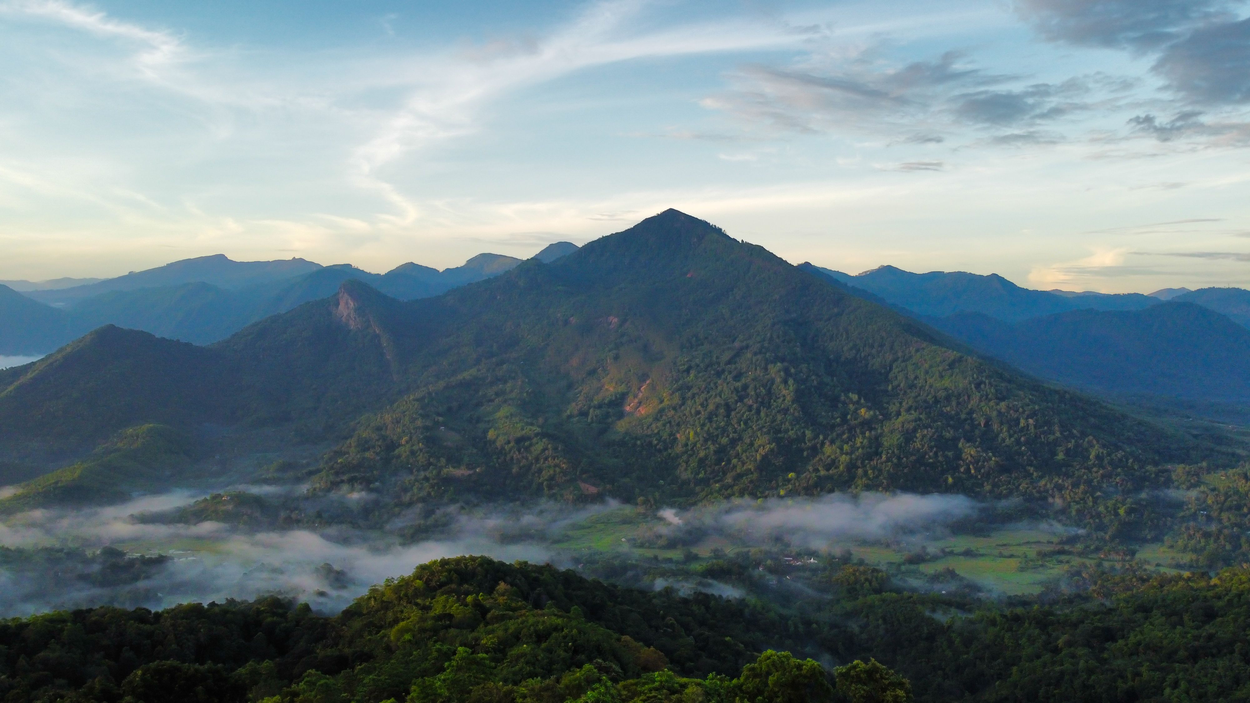 Breathtaking Aerial View of Misty Mountain Range · Free Stock Photo