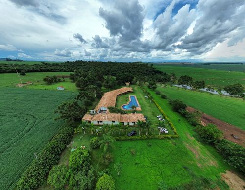 Free Aerial view of a countryside estate with pool and lush fields in Brazil. Stock Photo