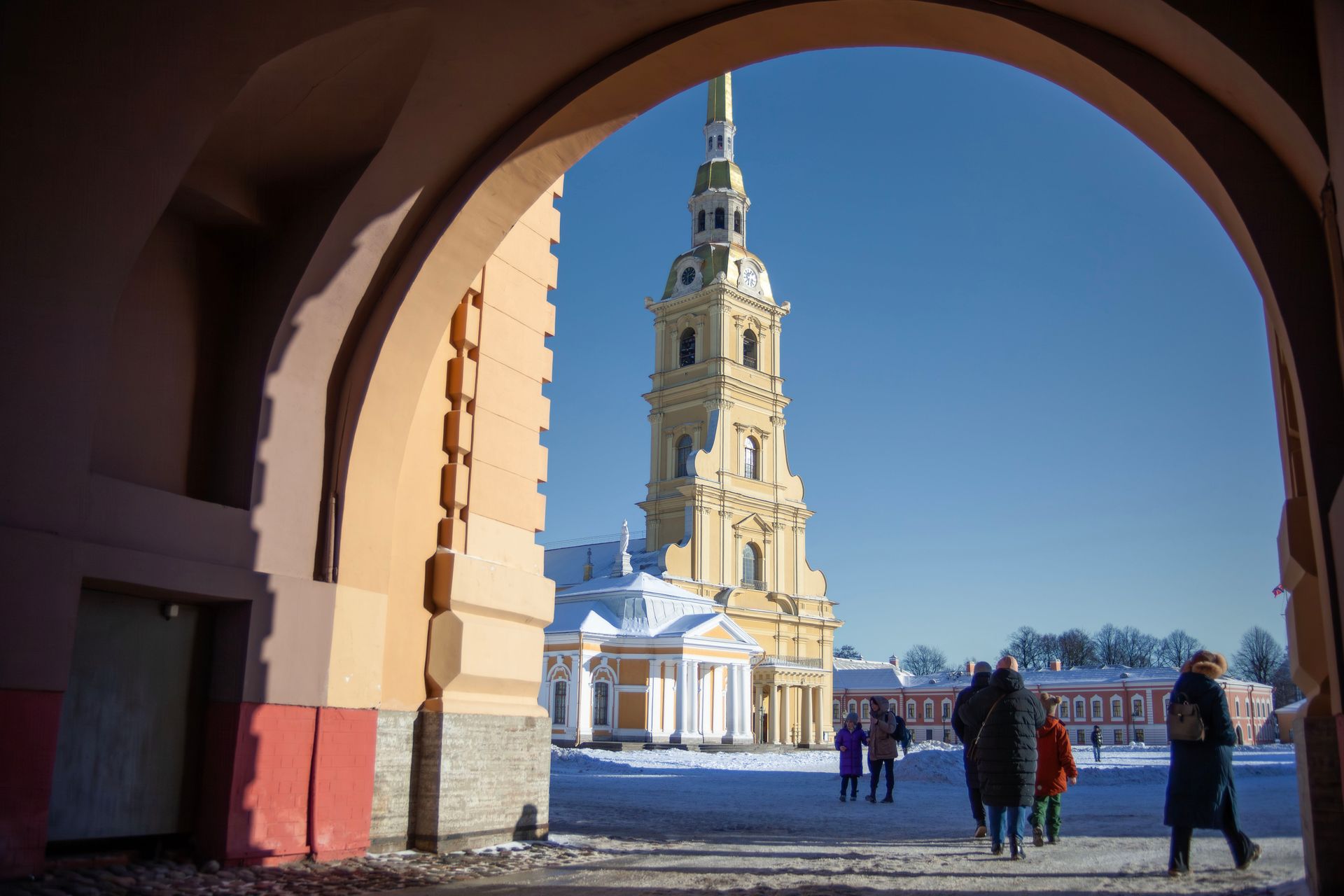 View of Peter and Paul Cathedral through archway in winter Saint Petersburg.