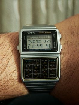 Close-up of a vintage Casio Data Bank watch displaying time and date.