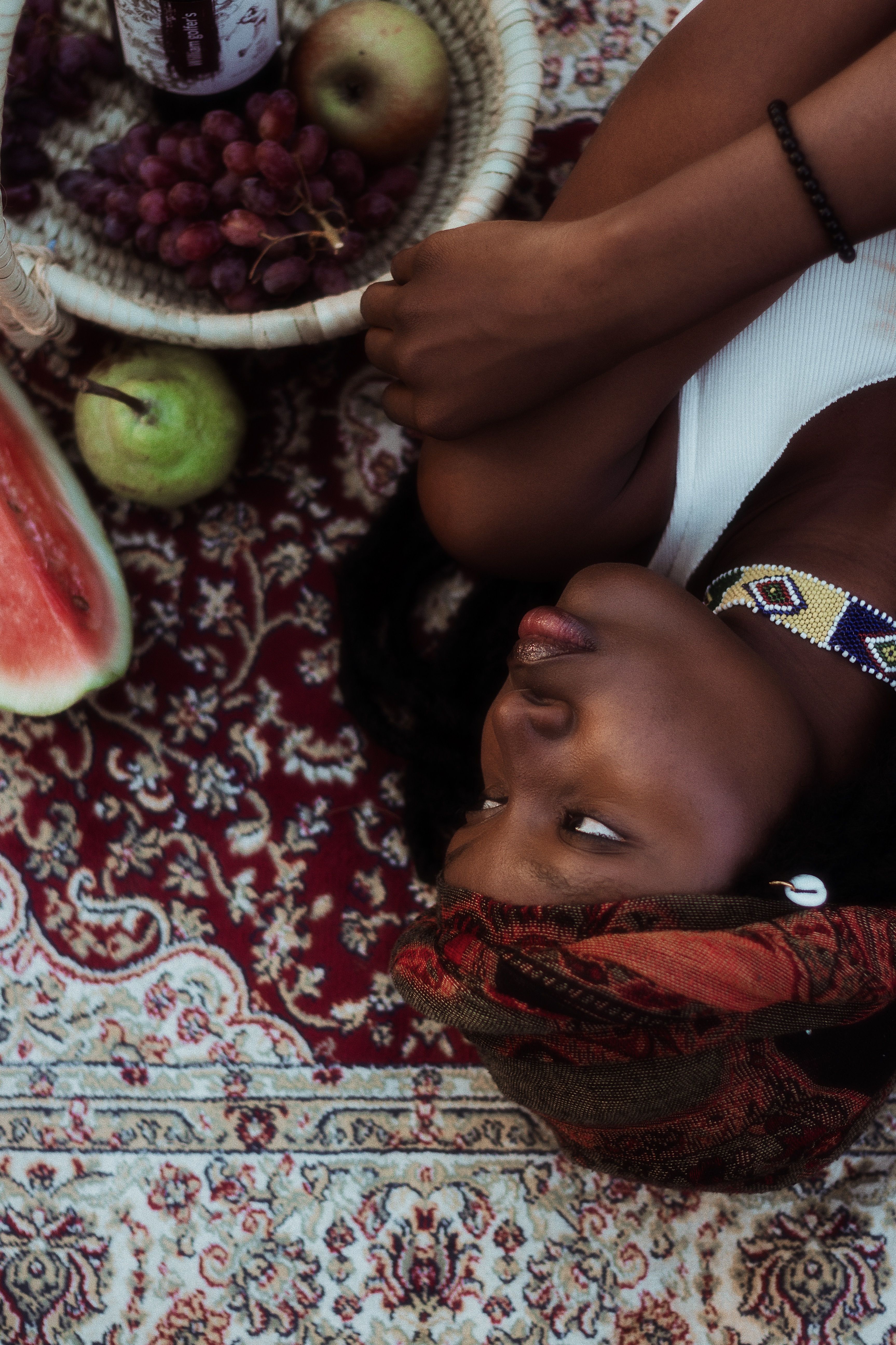 Portrait of a Woman with Traditional Headscarf on Rug · Free Stock Photo