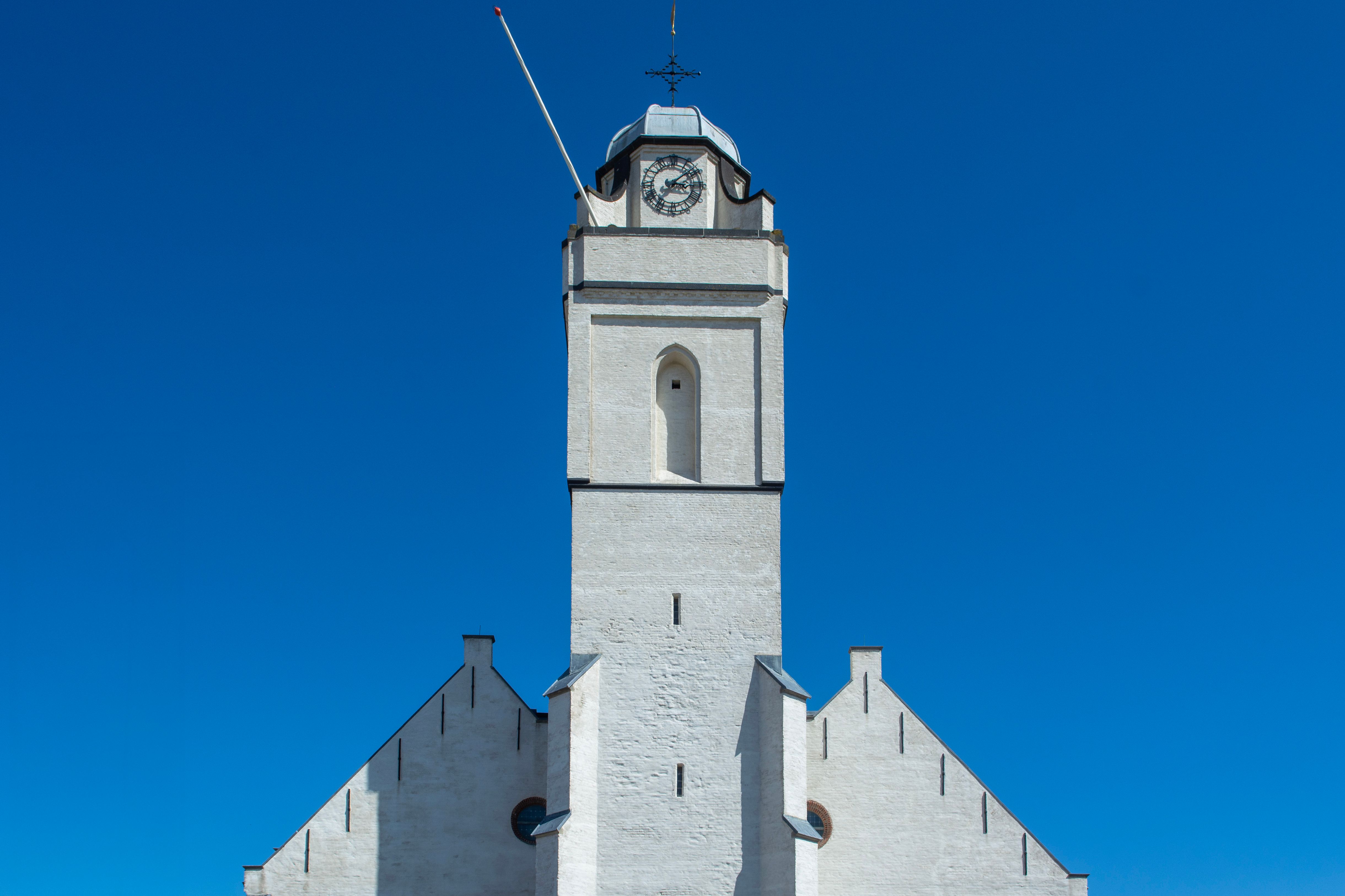 White Church Tower against Clear Blue Sky · Free Stock Photo