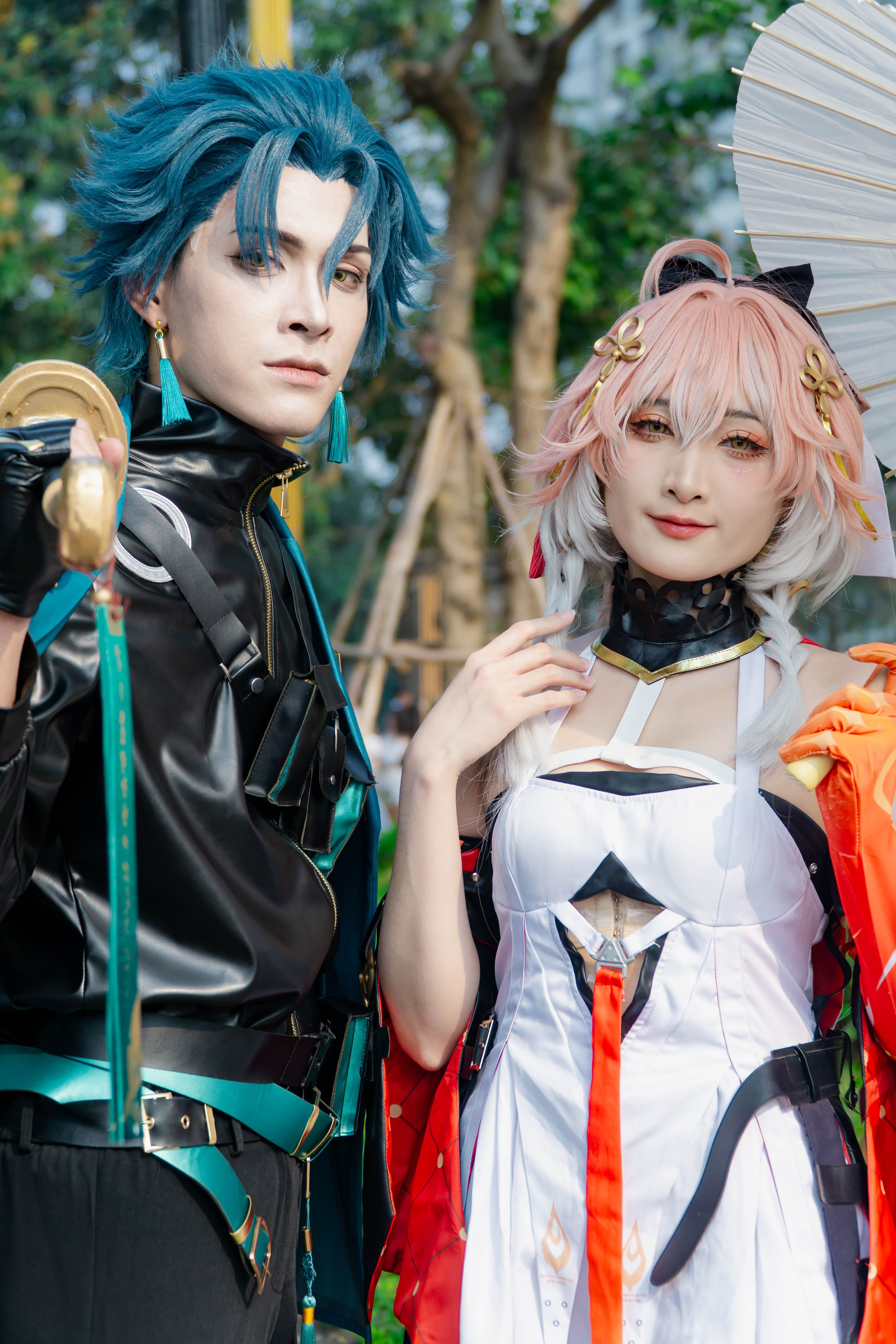 Colorful Cosplay Duo Posing Outdoors
