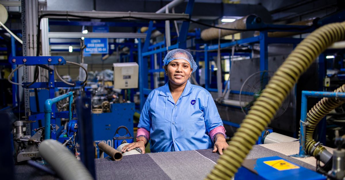 Female Textile Worker in Factory Setting · Free Stock Photo