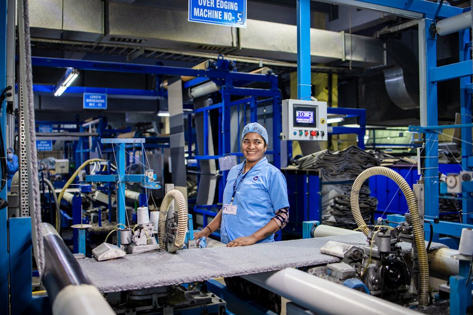 A modern, clean factory interior with automated machinery and workers in a bright, organized environment - global sourcing A modern, clean factory interior with automated machinery and workers in a bright, organized environment - global sourcing