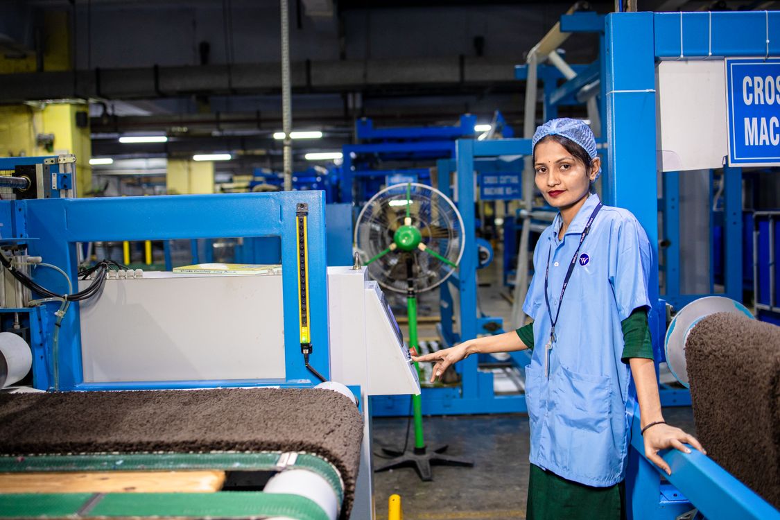 Female Factory Worker Operating Textile Machinery · Free Stock Photo