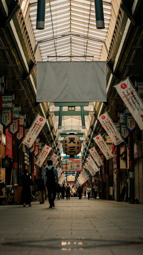 Free A vibrant scene in Osaka's famous shopping arcade, showcasing traditional Japanese architecture and culture. Stock Photo
