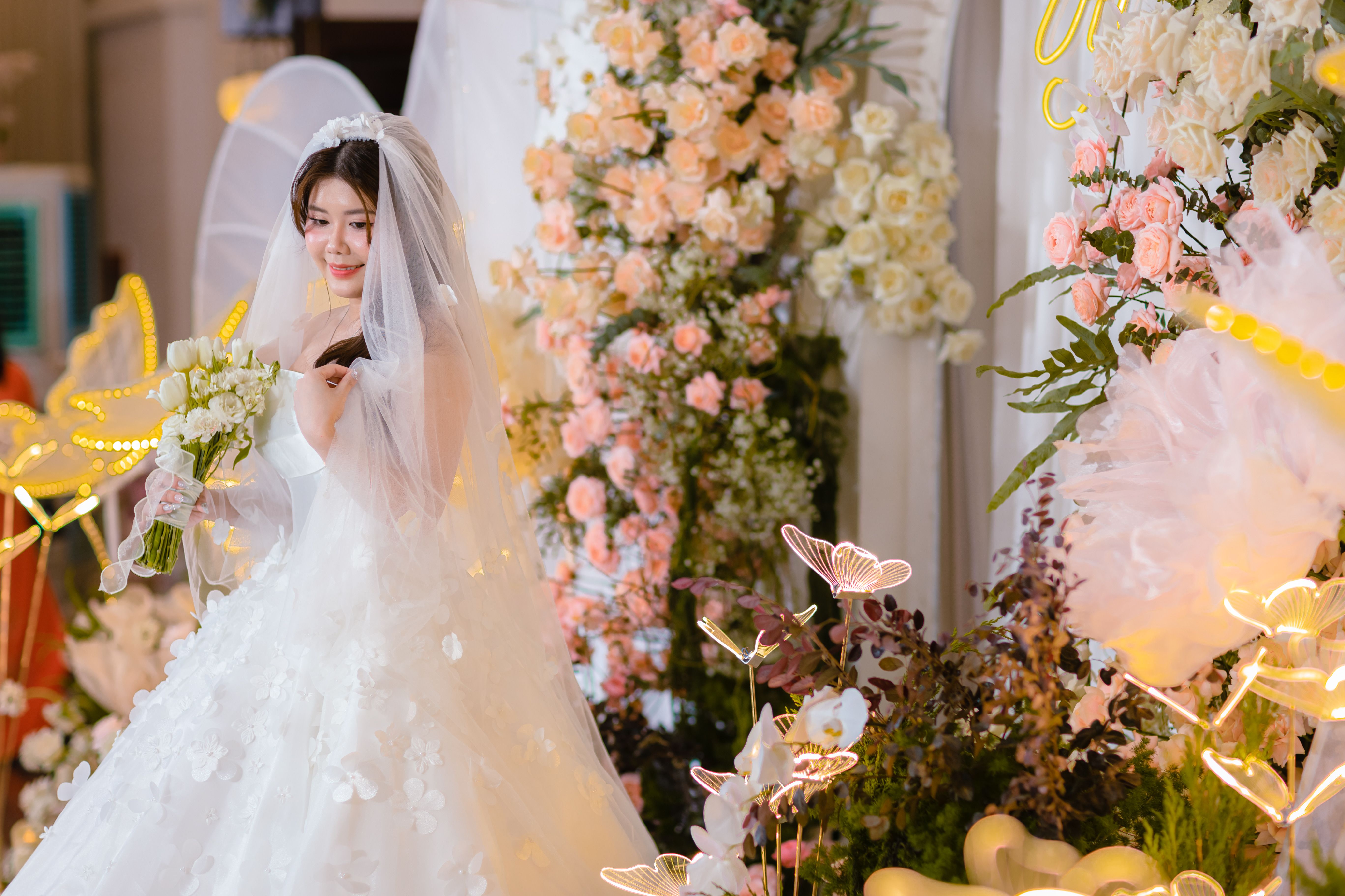 a bride holding a lush, neat wedding bouquet; Wedding atmosphere; Floral importance; Setting the tone - ftd flowers promo code