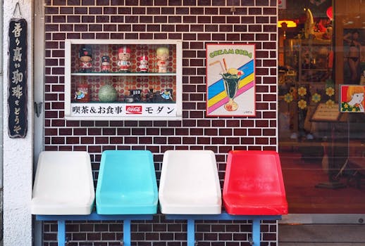 Vintage Japanese cafe with colorful decor and seating, showcasing retro charm.