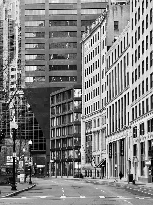 Free Black and white photo of downtown cityscape with tall buildings and street view. Stock Photo