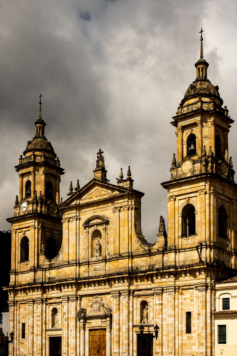 Historic Primada Cathedral in Bogota under a dramatic sky