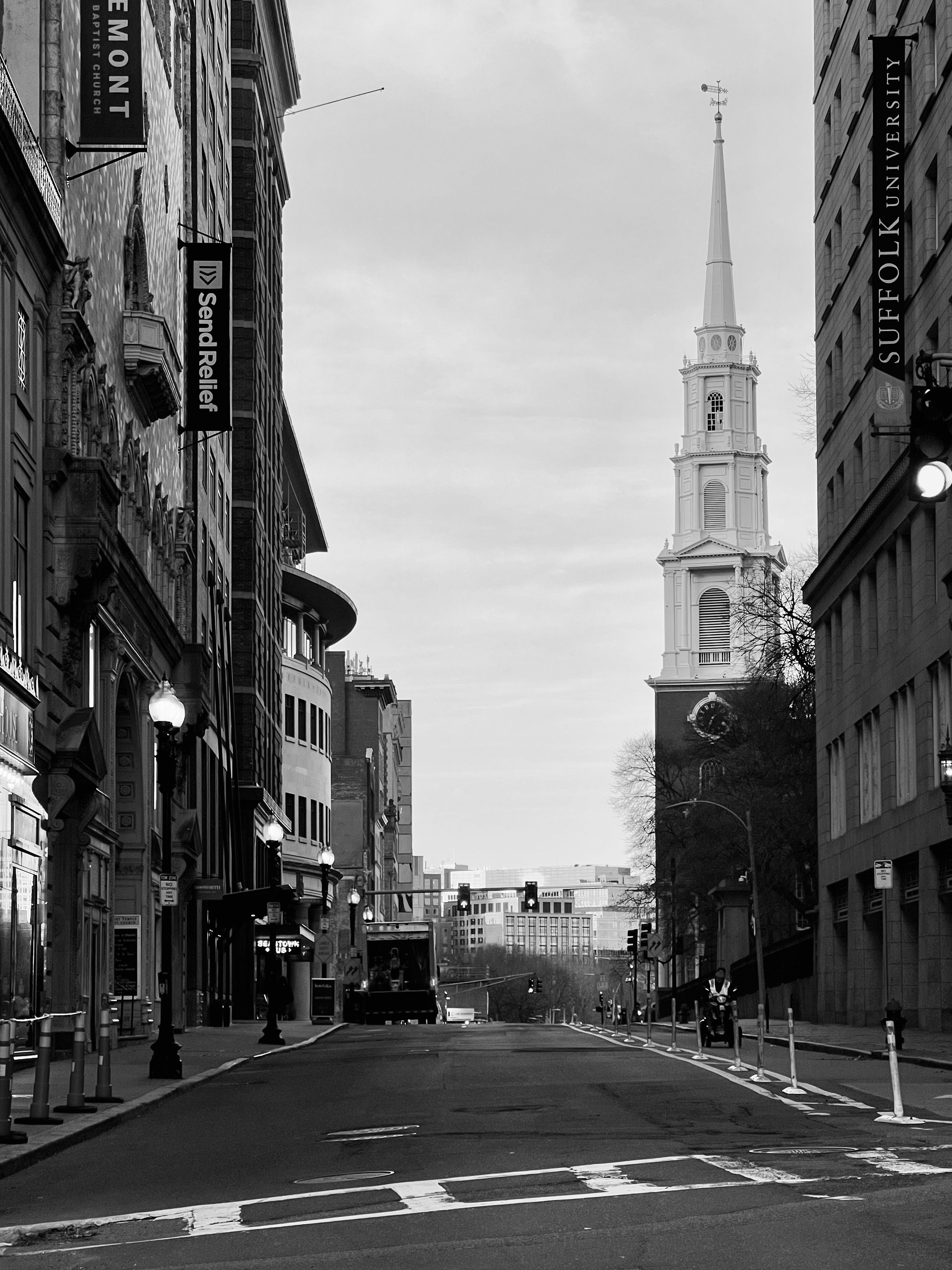 Black and White Downtown Street with Historic Church · Free Stock Photo