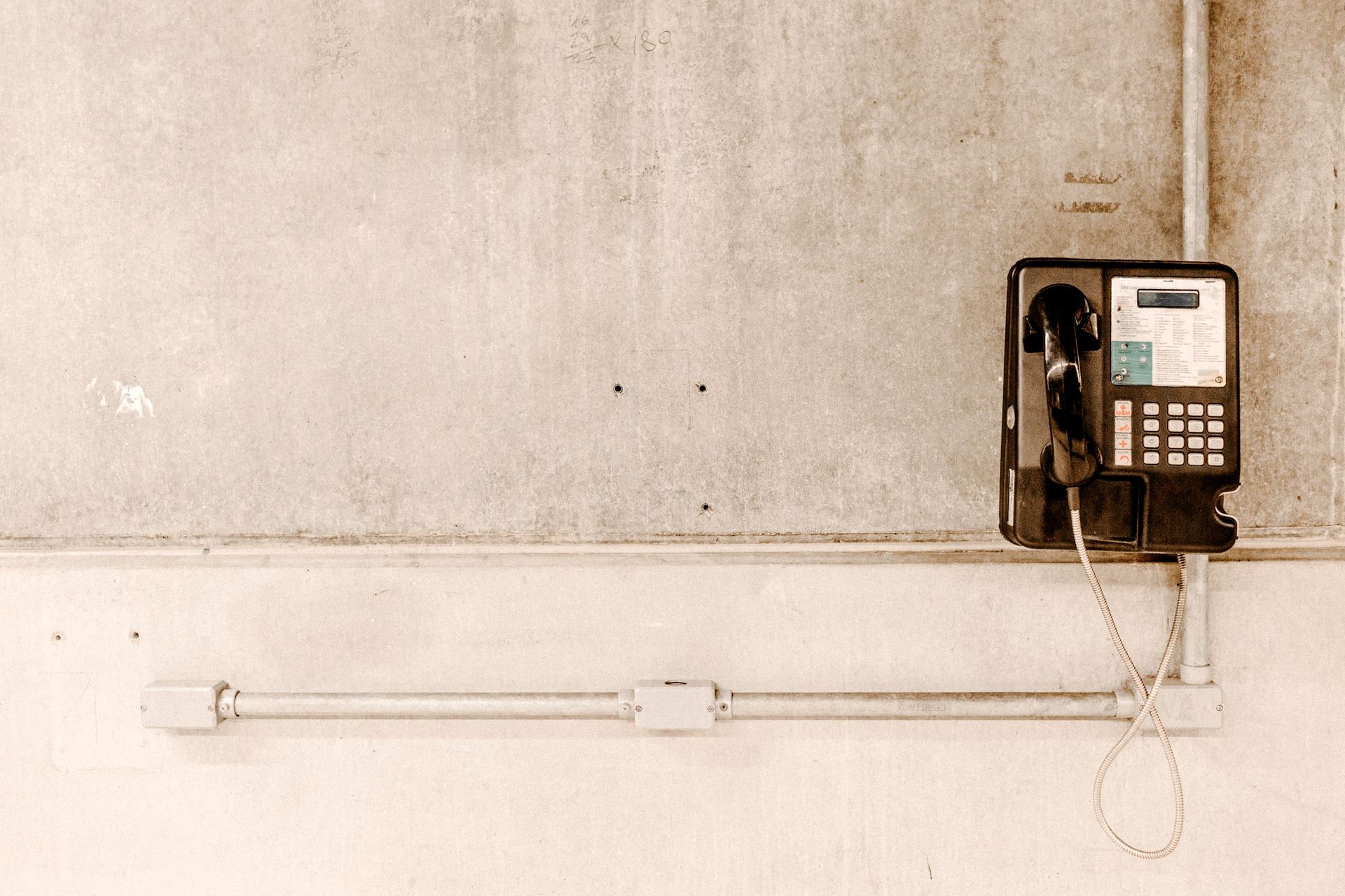 Coin Operated Telephone on the Wall