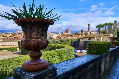 Free Stunning view of Florence featuring a terracotta planter foreground and city skyline with famous landmarks. Stock Photo