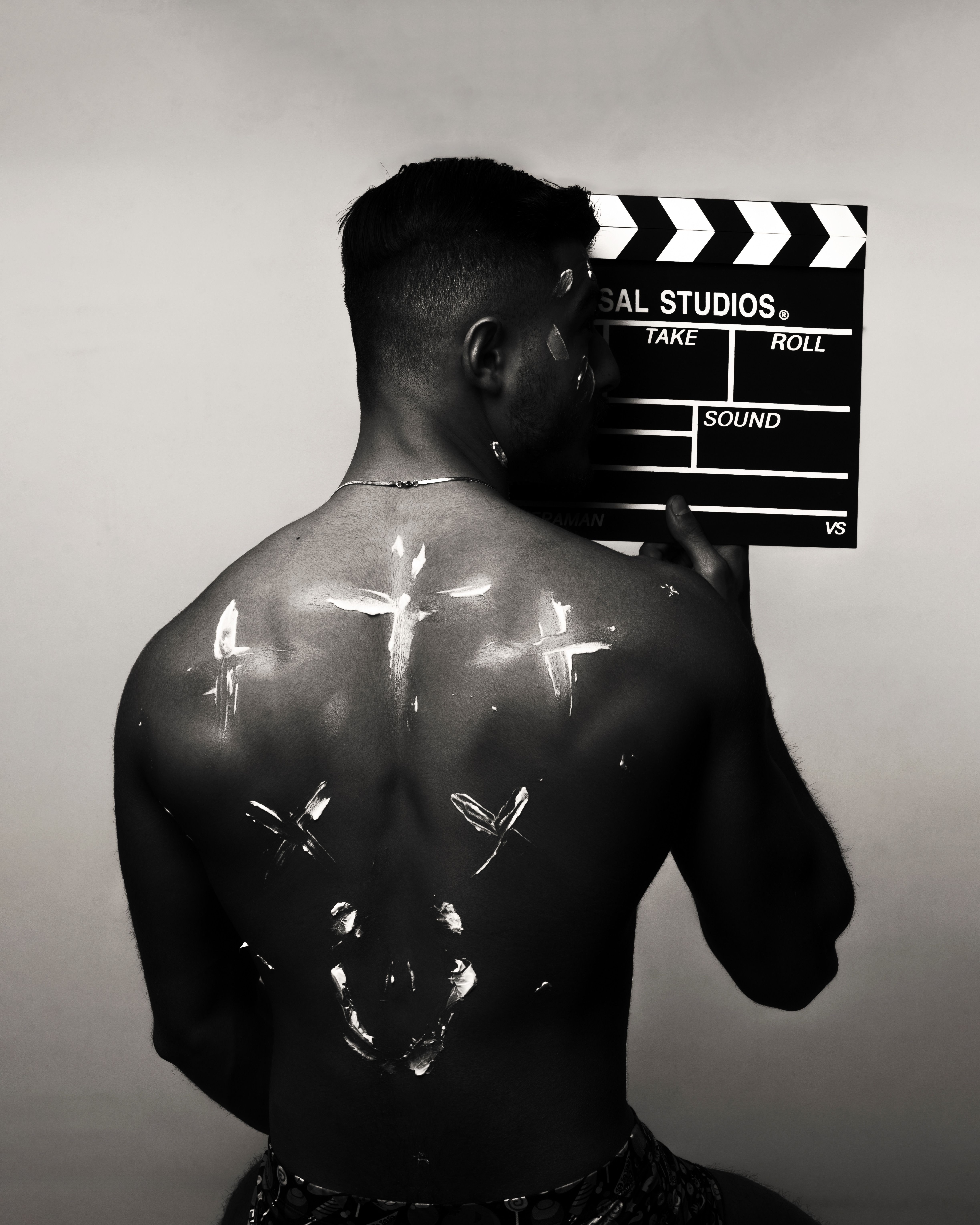 Artistic Black and White Portrait with Clapperboard · Free Stock Photo