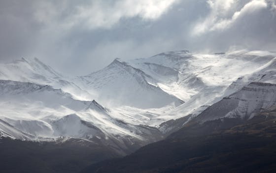 Stunning snow-covered mountain peaks in Argentina, captured in a winter landscape scene.