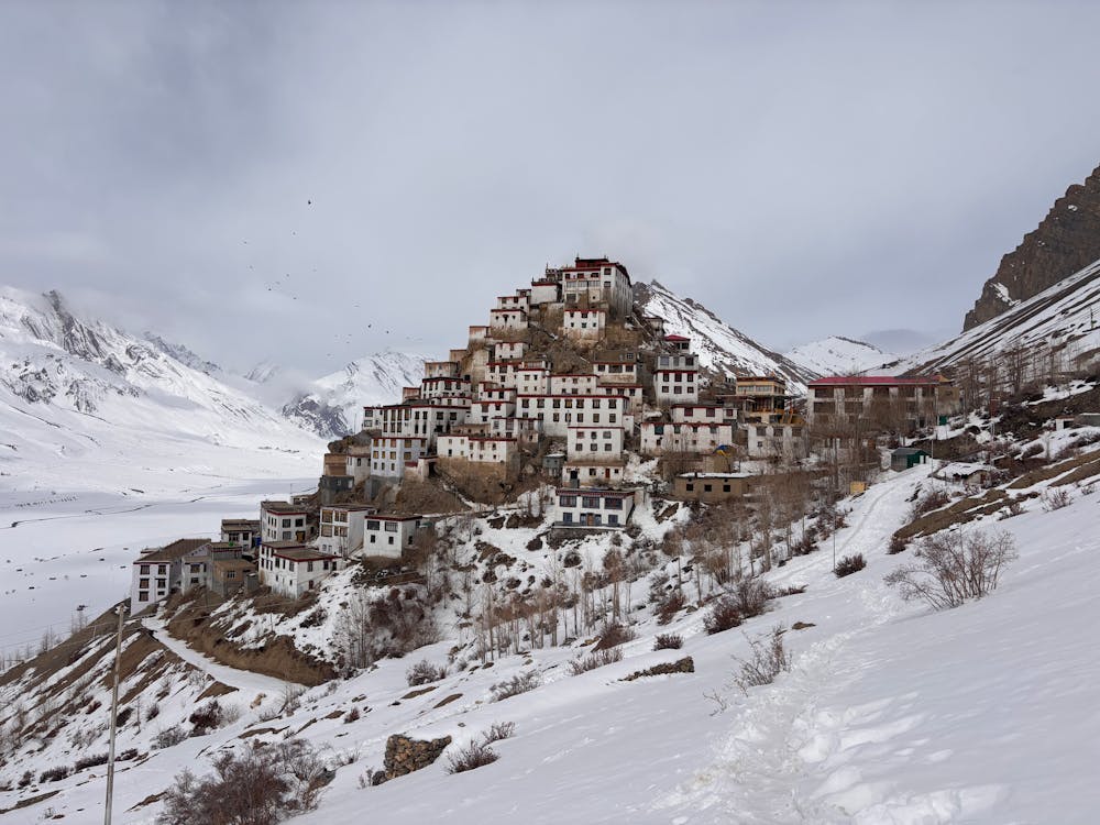 Free Stunning winter landscape of Kibber Village nestled in the snowy mountains of Himachal Pradesh, India. Stock Photo