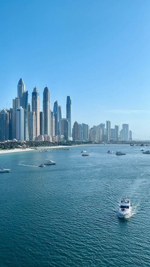 Free Stunning view of Dubai Marina skyline with yachts on a sunny day. Stock Photo