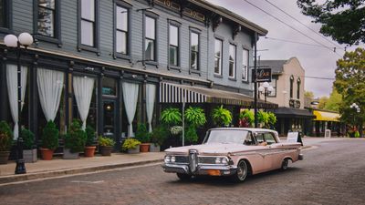 A vintage car parked on a small-town street — Vion Tam on Pexels