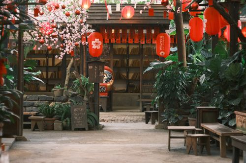 Free Serene Asian courtyard adorned with red lanterns, plants, and traditional decor. Stock Photo