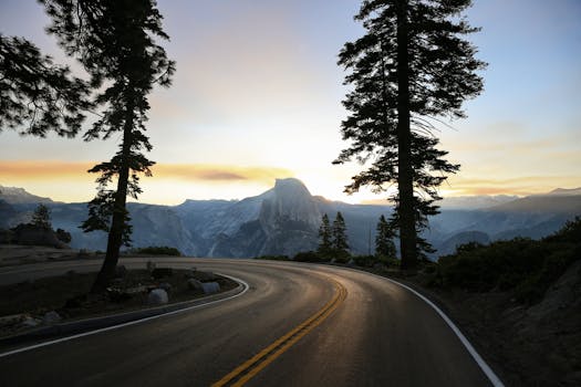 Breathtaking view of Half Dome from Glacier Point Road during sunset in Yosemite National Park.