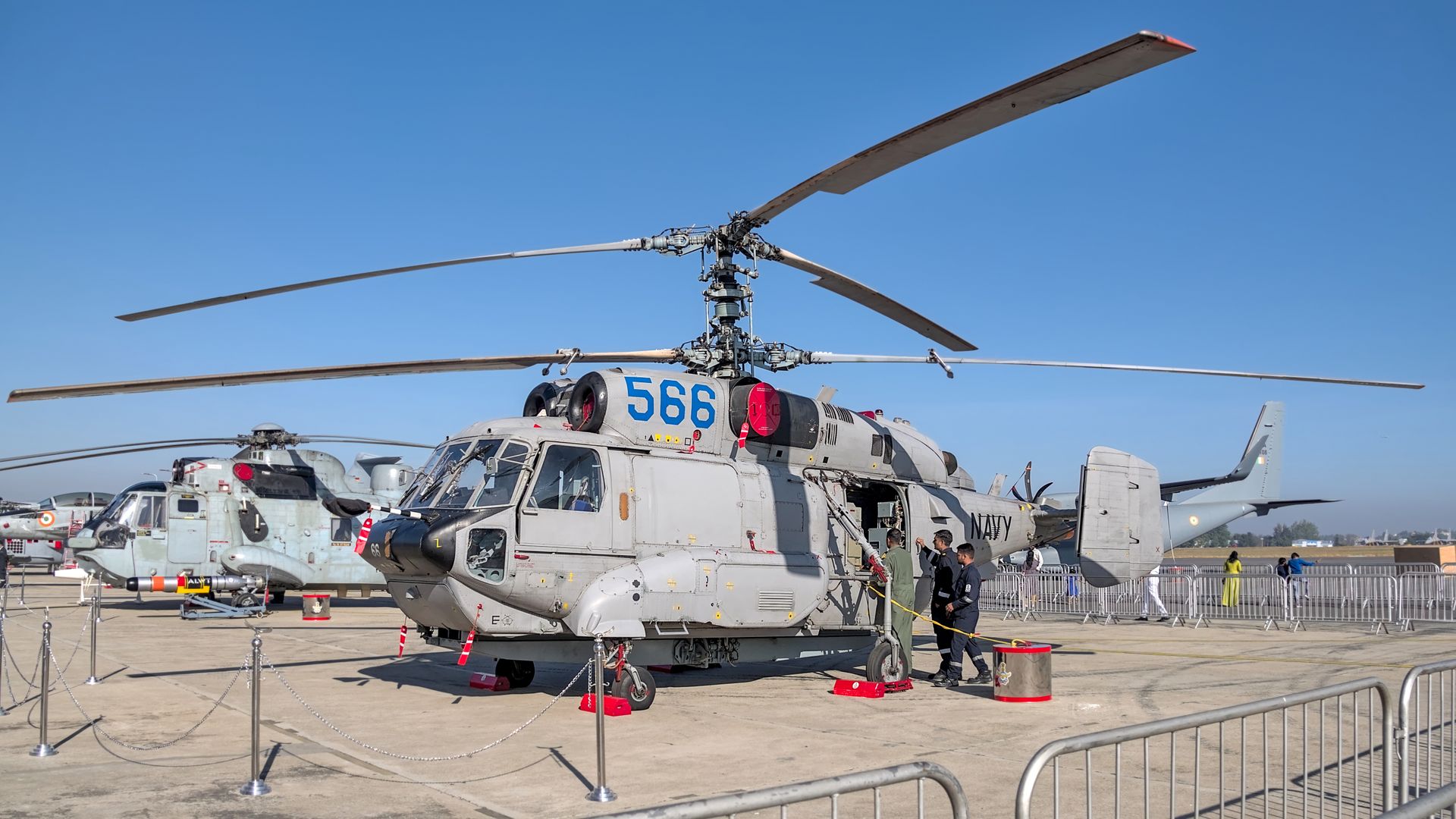 Military helicopters showcased at Aero India 2025 in Bengaluru, India, emphasizing aviation technology and defense.