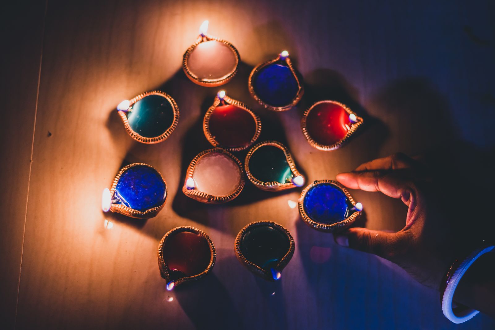 Traditional diya oil lamps arranged in a pattern during Diwali festival celebrations