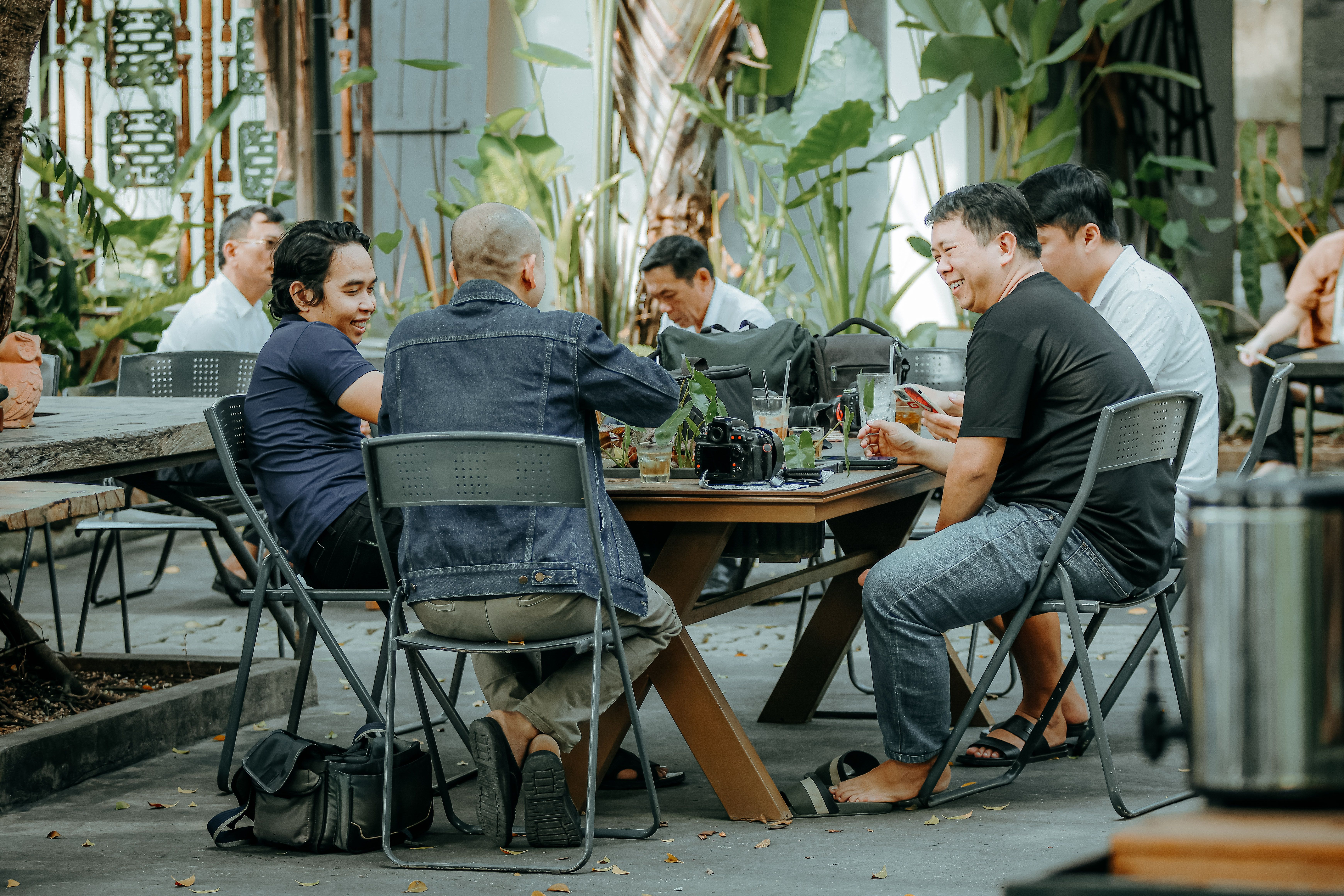 Three Men Sitting at the Table · Free Stock Photo