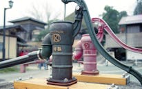 Vintage Water Pump in Traditional Japanese Setting