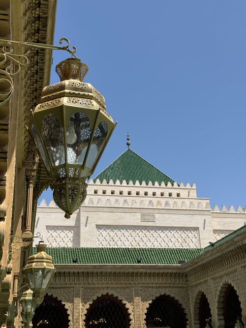 Free Elegant Moroccan lantern with traditional architecture under a clear blue sky in Rabat, Morocco. Stock Photo