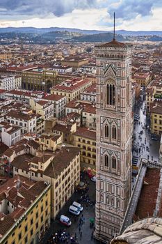 A stunning aerial view of Giotto's Campanile and Florence cityscape on a cloudy day.
