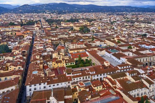 Free Aerial view showcasing Florence's iconic red-tiled rooftops and cityscape. Stock Photo
