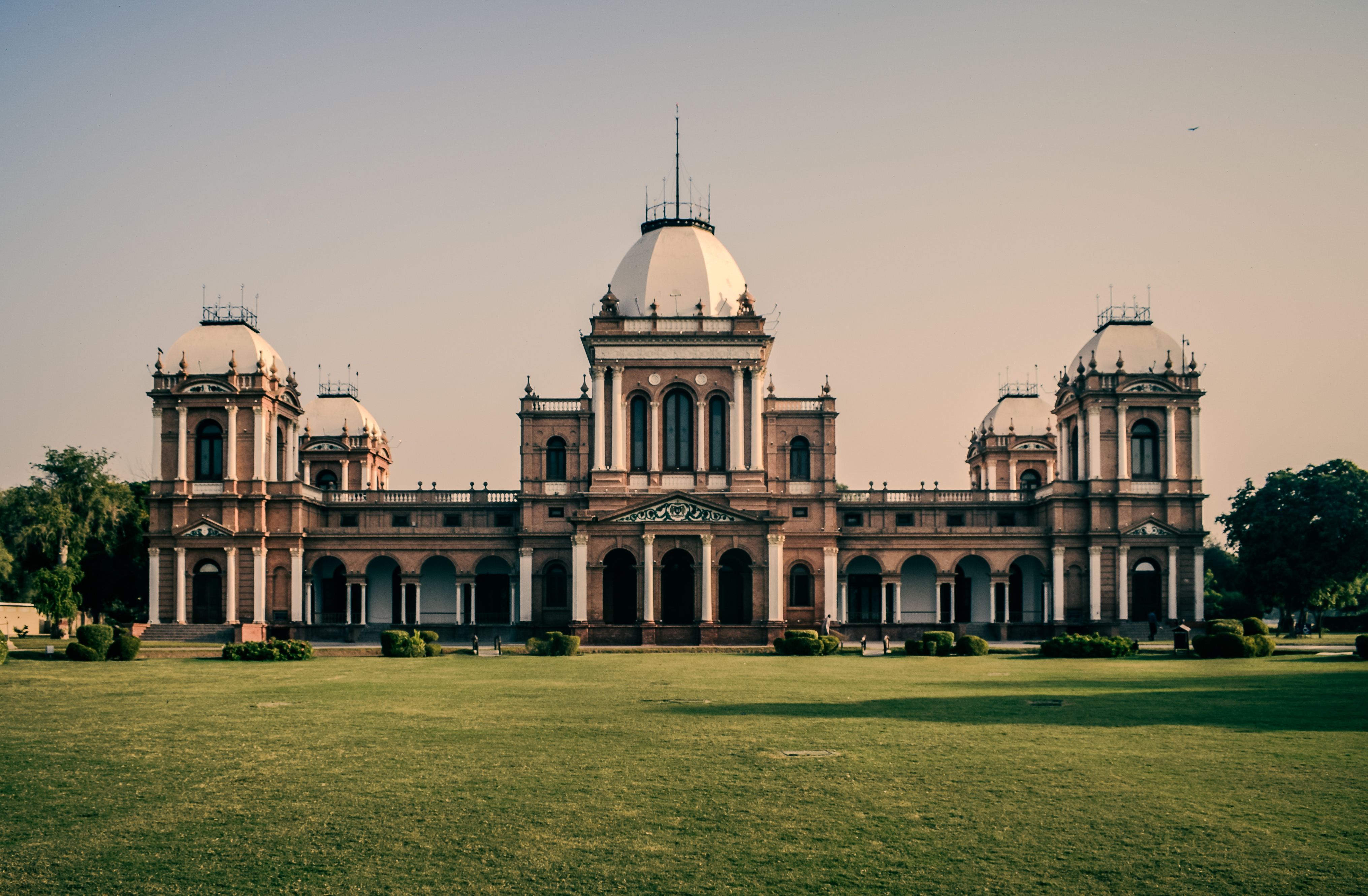 Front view of Noor Mahal, a historical palace in Bahawalpur, Pakistan, captured in daylight.