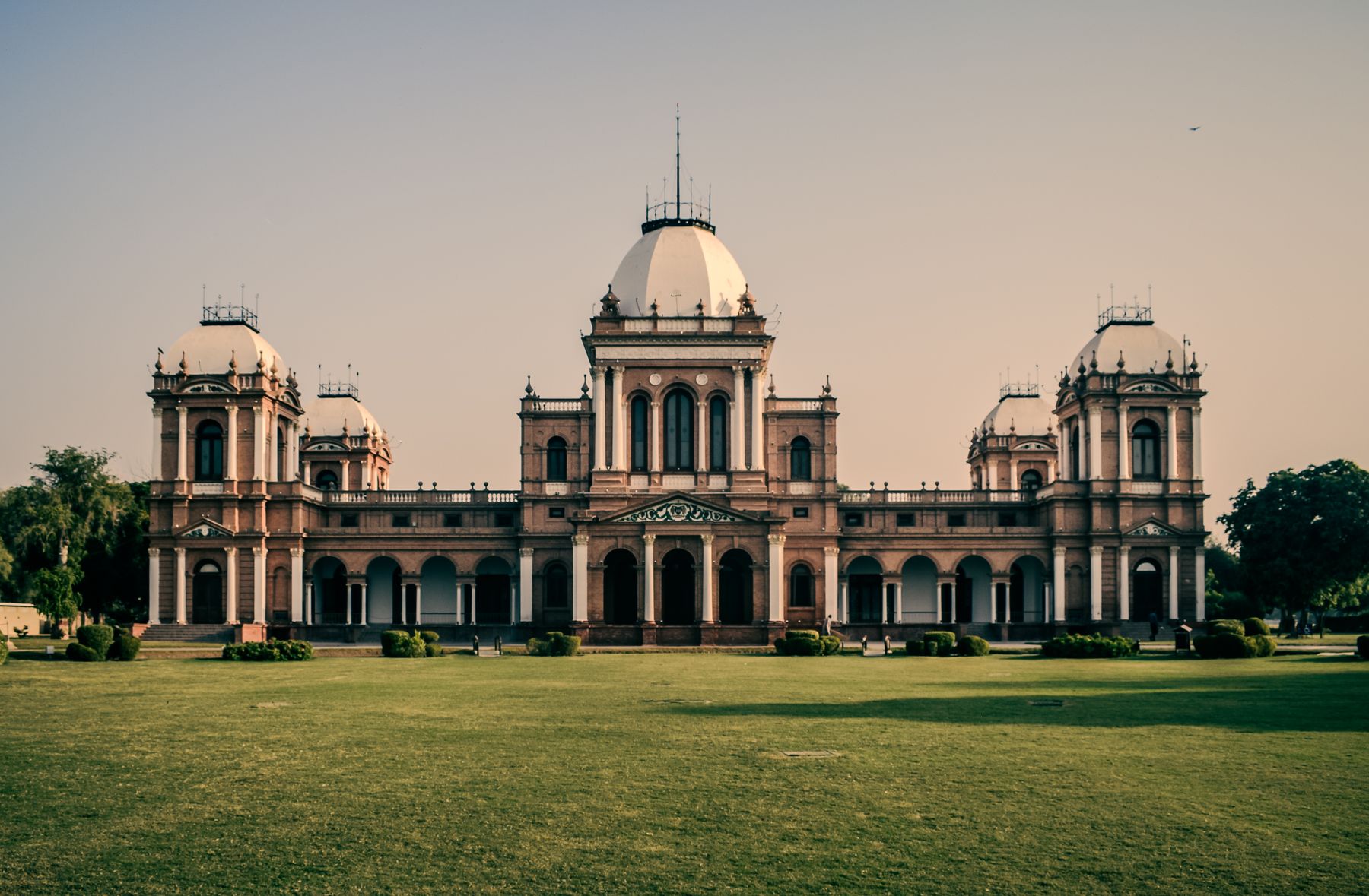 Front view of Noor Mahal, a historical palace in Bahawalpur, Pakistan, captured in daylight.
