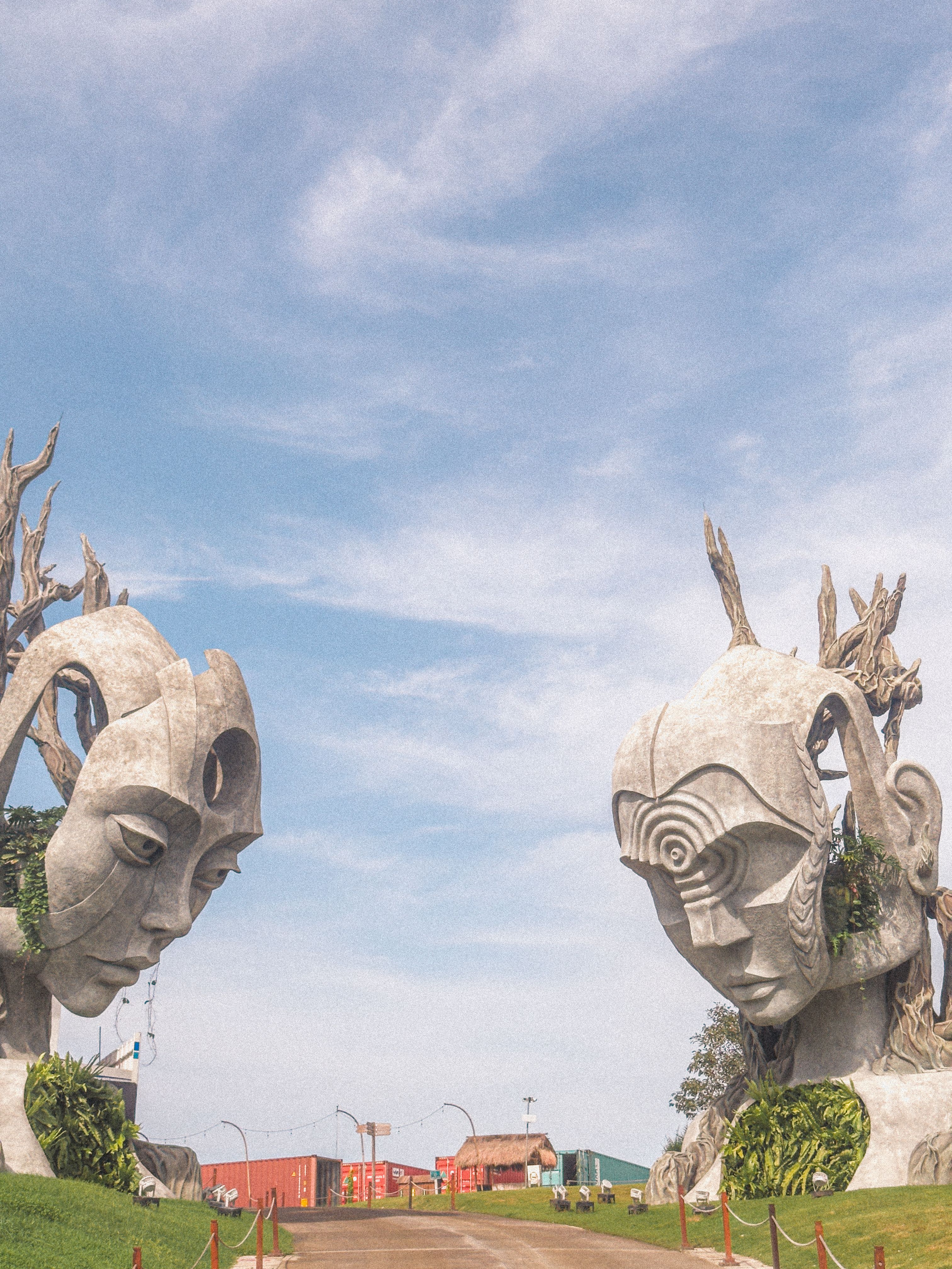 Majestic Stone Sculptures Under Blue Sky · Free Stock Photo