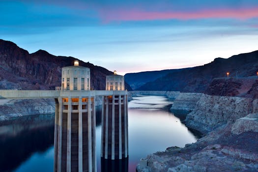 Stunning capture of Hoover Dam and reservoir during blue hour, showcasing its architectural marvel