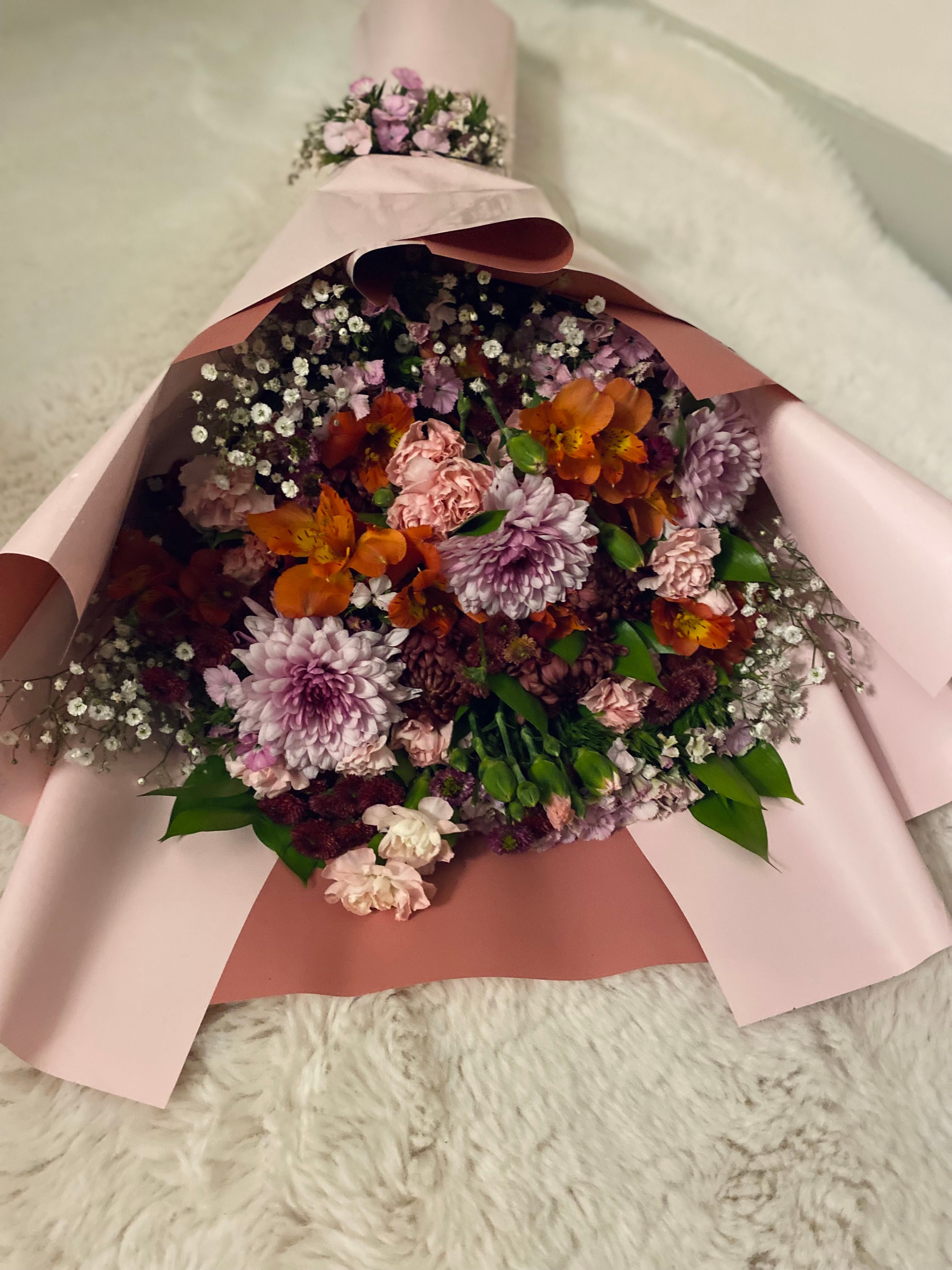 Anniversary gift bouquet wrapped in elegant paper
