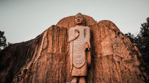 Free Captivating view of the Buduruwagala Buddha statue at sunset in Sri Lanka. Stock Photo