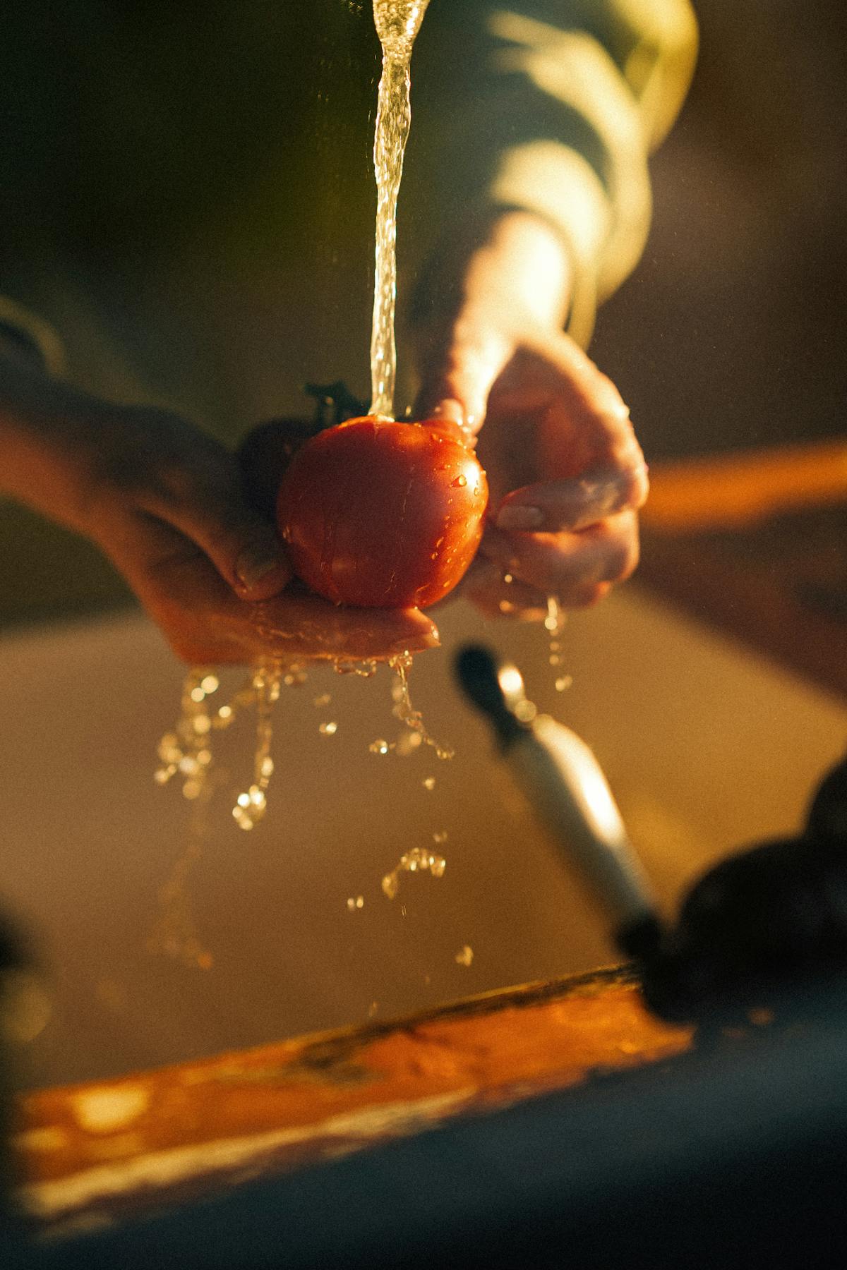 free-photo-of-hands-washing-fresh-tomato-in-warm-kitchen-light.jpeg?auto=compress&cs=tinysrgb&w=1200