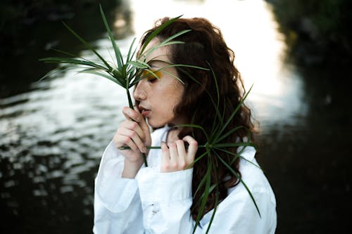 Woman Holding Leaves