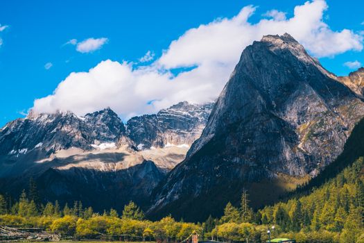 Majestic mountains under bright blue sky, perfect for nature lovers.