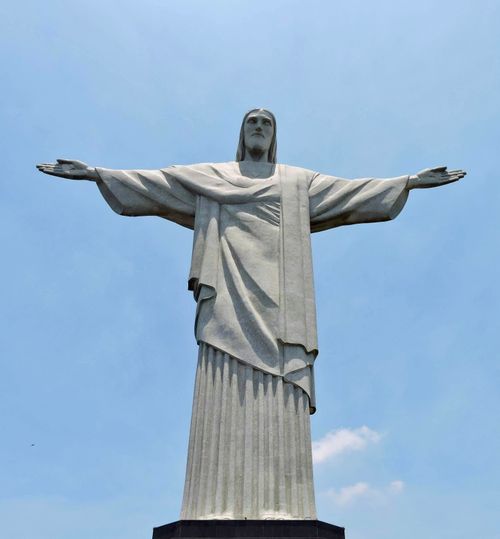 Free Iconic Christ the Redeemer statue against blue sky in Rio de Janeiro, Brazil. Stock Photo