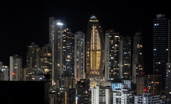 Stunning night view of Panama City's skyscrapers with bright lights and modern architecture.
