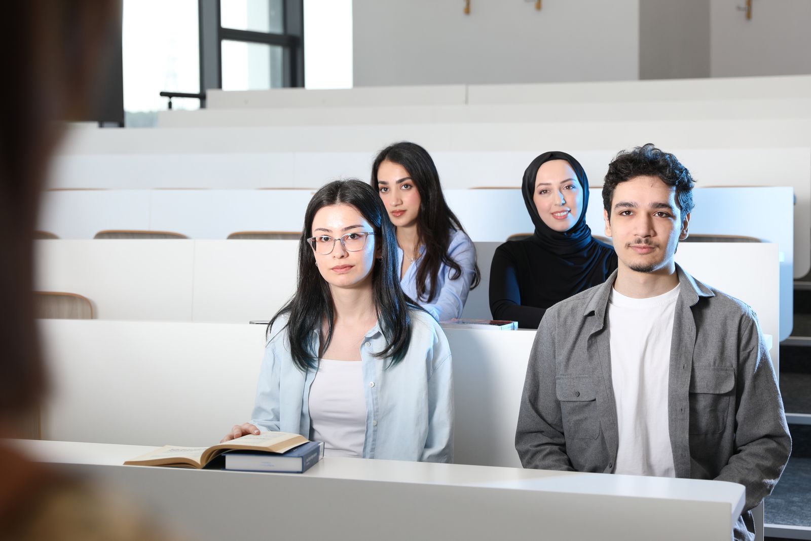 Students seated in a university lecture hall