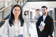 Young Adults Studying in Modern Library